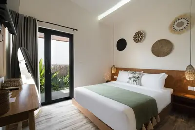 a bedroom with a bed and a large window at Villa Teide by BaliSuperHost in Canggu