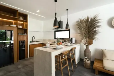 a kitchen with a island in the middle of a room at Villa Teide by BaliSuperHost in Canggu