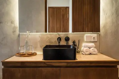 a kitchen counter with a sink and towels at Villa Teide by BaliSuperHost in Canggu