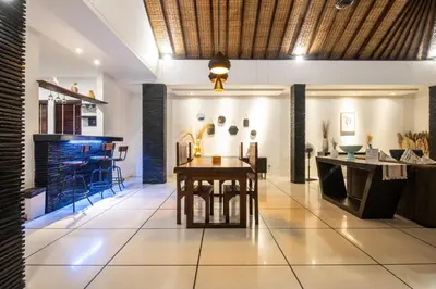 a living room with a table and a couch at Vase 2BR Villa Seminyak in Seminyak