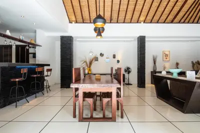 a dining room with a table and chairs at Vase 2BR Villa Seminyak in Seminyak