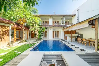 an external view of a villa with a swimming pool at Tuluscoliving Villa Legian 4 Bedrooms and 4 Bathroom in Legian
