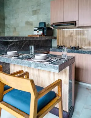 a kitchen with a counter with two bowls on it at Villa Maharani Sanur in Sanur