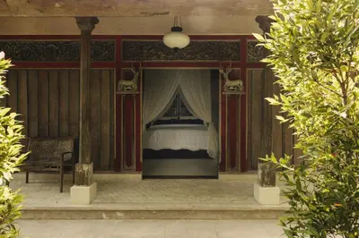 a bedroom with a bed with a canopy at Magia de Uma, a Member of Design Hotels in Canggu