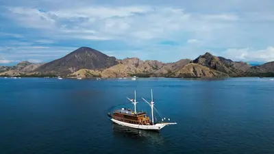 a boat in the middle of a large body of water at Boat Komodo in Seminyak
