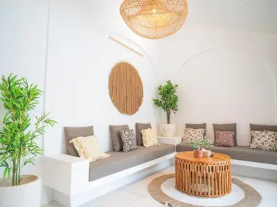 a living room with a couch and some plants at Harbie Villa 1 in Seminyak