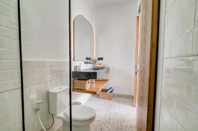 a bathroom with a toilet and a sink at FYM LOVE VILLA Residence BALI in Kerobokan