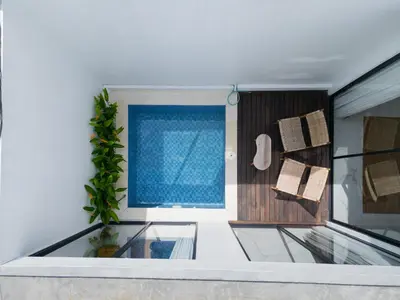 a room with a glass floor and a window at FYM LOVE VILLA Residence BALI in Kerobokan