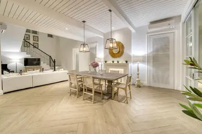 a dining room with a table and chairs at Colonial House 4BR Villa With Ocean View in Berawa in Canggu