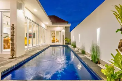 a swimming pool in the middle of a house at Ardelle 2 BR Private Pool Villa in Canggu