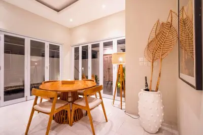 a dining room with a table and chairs at Ardelle 2 BR Private Pool Villa in Canggu