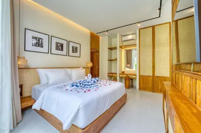 a bedroom with a large white bed in a room at Tropical 3BR Villa 2 Private Pools in Jimbaran in Jimbaran