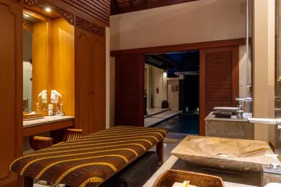 a kitchen with a table and a sink in a room at Villa Elegant by Exotiq in Seminyak