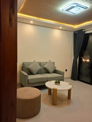 a living room with a couch and a coffee table at Seminyak Apartment 37 in Seminyak