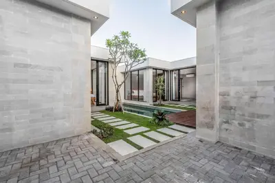 an external view of a house with a courtyard at Jimbaran Villa in Jimbaran