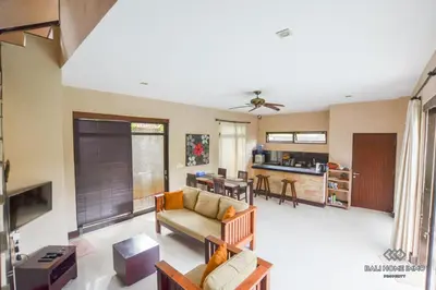 a living room with a couch and a table at Villa Ayu in Kerobokan
