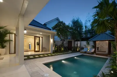 a swimming pool in the backyard of a villa at Alegria De La Casa Seminyak in Seminyak