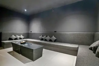 a living room with a couch and a table at Davion 6 BR Private Pool Villa in Seminyak