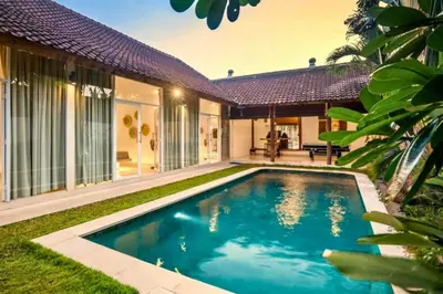 a swimming pool in the backyard of a house at Davion 6 BR Private Pool Villa in Seminyak