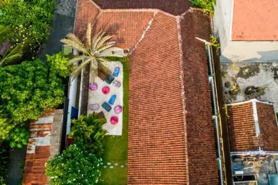 an overhead view of a brick building with a palm tree at Davion 6 BR Private Pool Villa in Seminyak