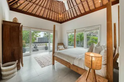 a bedroom with a bed and a large window at Villa Meya 3 Bedroom Villa in Central Seminyak in Seminyak