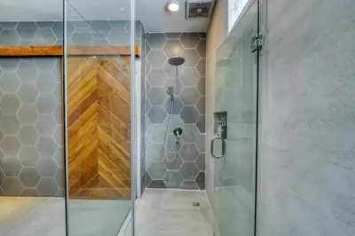 a shower with a glass door in a bathroom at Villa Meya 3 Bedroom Villa in Central Seminyak in Seminyak