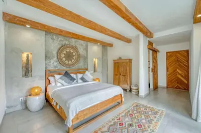 a bedroom with a large bed in a room at Villa Meya 3 Bedroom Villa in Central Seminyak in Seminyak