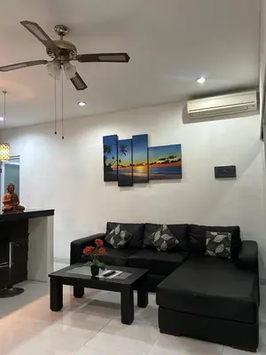 a living room with a couch and a ceiling fan at Villa Goodison - Two Bedrooms in Legian