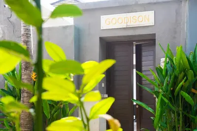 a building with a sign that reads goodison at Villa Goodison - Two Bedrooms in Legian