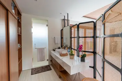 a bathroom with a sink and a mirror at JB Hazel, 4Bedroom villa in Jimbaran in Jimbaran
