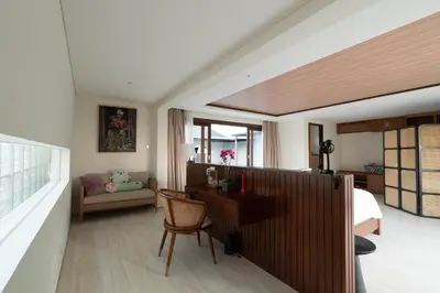 a bedroom with a bed and a desk and a chair at JB Hazel, 4Bedroom villa in Jimbaran in Jimbaran