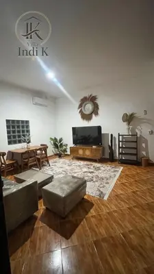 a living room with a couch and a table at 2 Bedrooms Private Pool Villa Indi K Kerobokan in Seminyak