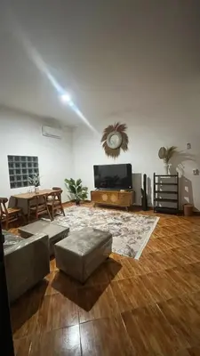 a living room with a couch and a table at 2 Bedrooms Private Pool Villa Indi K Kerobokan in Seminyak