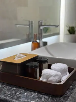 a tray with towels and other items in a sink at Villa Jiwanta by Maheswara in Kerobokan