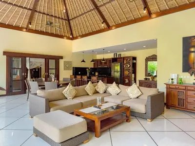 a living room with a couch and a table at Luxury 4BR - Villa Santai - Central Seminyak in Seminyak