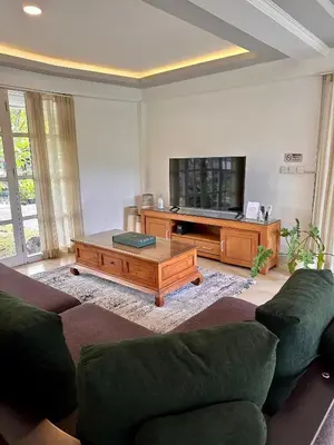 a living room with a couch and a coffee table at Wangi Melati Homestay in Kerobokan