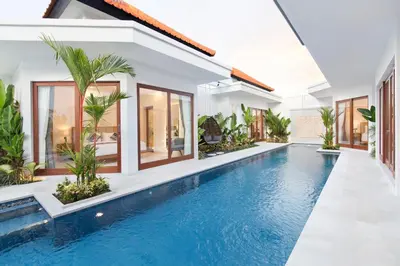 an indoor pool in a villa with a swimming pool at Villa Mia Seminyak - Boutique Villas - I in Seminyak