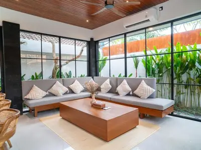 a living room with a couch and a coffee table at Harbie Villa 2 in Badung