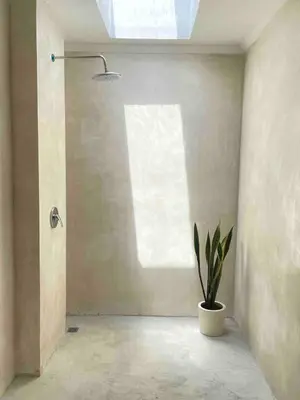 a bathroom with a potted plant and a window at Villa Jiji cozy chic in Bali - just renovated ! in Canggu