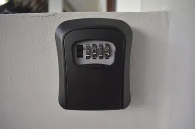 a remote control attached to the side of a table at Banana Room Near to Kuta Legian Beach in Legian