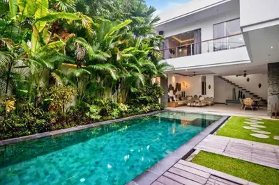 a swimming pool in the backyard of a house at Feodora Peaceful 4 BR Private Pool Villa in Seminyak