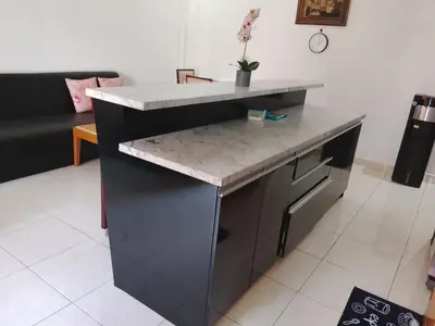 a kitchen with a counter with a sink at Kuta Grace house Bali in Kuta