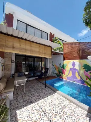 a house with a swimming pool in the yard at Villa 1 Kavi minimalis 1 Kamar di Sanur in Sanur