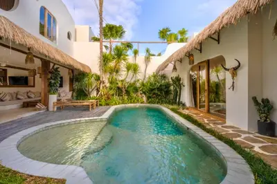 a swimming pool in the backyard of a house at Adena Modern Paradise 3 BR Private Pool Villa in Kerobokan