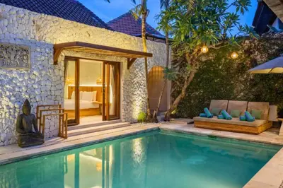 a swimming pool in front of a villa at Erianthe Peaceful 3 BR Private Pool Villa in Kerobokan