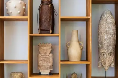 a shelf with vases and other items on it at Erianthe Peaceful 3 BR Private Pool Villa in Kerobokan