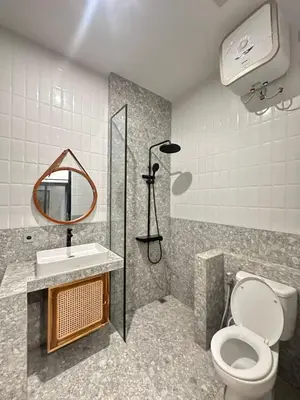 a bathroom with a toilet and a sink and a mirror at Della Solea Seminyak in Seminyak