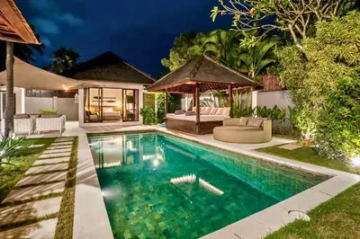 a swimming pool in a backyard with a gazebo at Monique 3 BR Private Pool Villa in Seminyak
