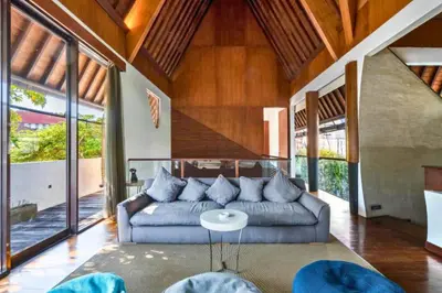 a living room with a couch and a table at Sayara Modern 3 BR Private Pool Villa in Seminyak