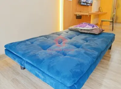 a large blue bed sitting on the floor in a room at Newly Lavaya Resort 1BR with pool in Nusa Dua